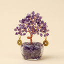 Yue TerraBrio Sovereign Wisdom amethyst crystal tree with hand-twisted copper wire, clear glass pot, and tumbled stone base.