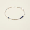 Yue TerraBrio Stellar Horizon necklace with a freshwater baroque pearl, Afghan lapis lazuli, sodalite, stick pearls, and sterling silver clasp.