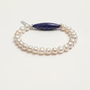 Yue TerraBrio Stellar Horizon bracelet with Afghan lapis lazuli, 7mm egg-shaped freshwater pearls, Thai silver spacer beads, and a sterling silver logo tag.