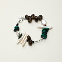 A temple-consecrated bracelet featuring Smoky Quartz, Malachite, and Black Tourmaline with an engravable S925 sterling silver tag for grounding and energetic protection.