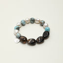 Yue TerraBrio Terra-Oceanic Equilibrium bracelet with oval smoky quartz beads, larimar, freshwater baroque pearls, and sterling silver details.
