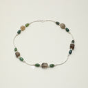Yue TerraBrio Verdant Ascent necklace with Thousand-Layer Phantom Quartz, Moss Agate, and seed pearls.