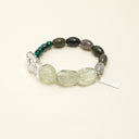 Yue TerraBrio Verdant Renewal bracelet with freeform green quartz, water grass agate rice beads, malachite disc beads, clear quartz tusk beads, and a sterling silver logo tag.