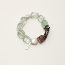 Yue TerraBrio Verdant Stillness bracelet with freeform green quartz, smoky quartz tusk beads, baroque waterdrop pearl, and a sterling silver logo tag.