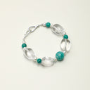 Yuè TerraBrio Veridian Resonance bracelet featuring a bold 12mm Amazonite center stone, irregular clear quartz, and seed pearls in S925 silver.